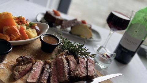 Savour exquisite steak and wine with sea views in our hotel's cosy restaurant, featuring gourmet dining and a welcoming ambience.