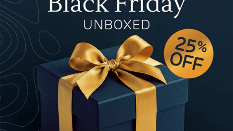 Black gift box with golden bow offering 25% off at Shoreline Hotel. Enjoy Prosecco, bed and breakfast deals from €99.