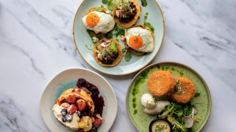 Three dishes served on a marble table