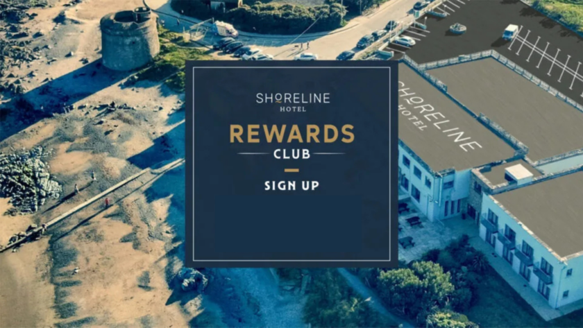 Coastal hotel aerial view, beachside amenities, lush landscape; perfect for relaxing getaways. Sign up for rewards.