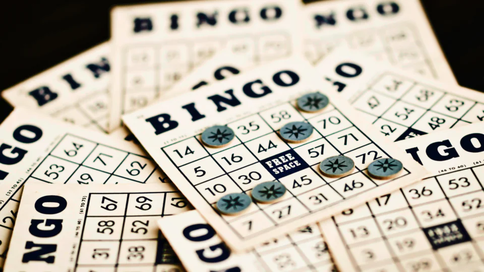 Enjoy a lively bingo night with friends at our hotel, featuring classic cards and marker chips, perfect for social gatherings.